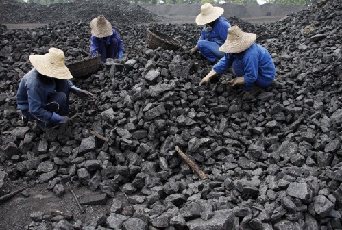 Chinese miners process coal from a mine